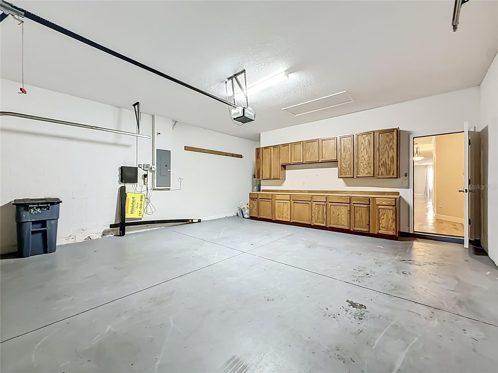 two car garage with nice storage for workshop