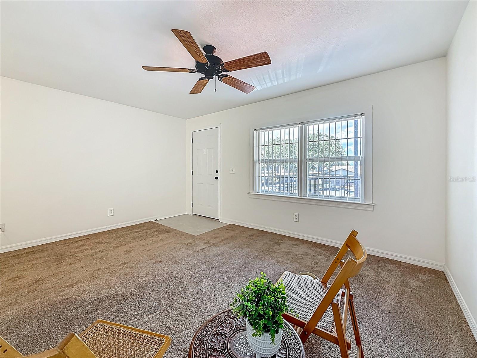 2442 Enterprise Rd no 6, living area, front window and entry door to left