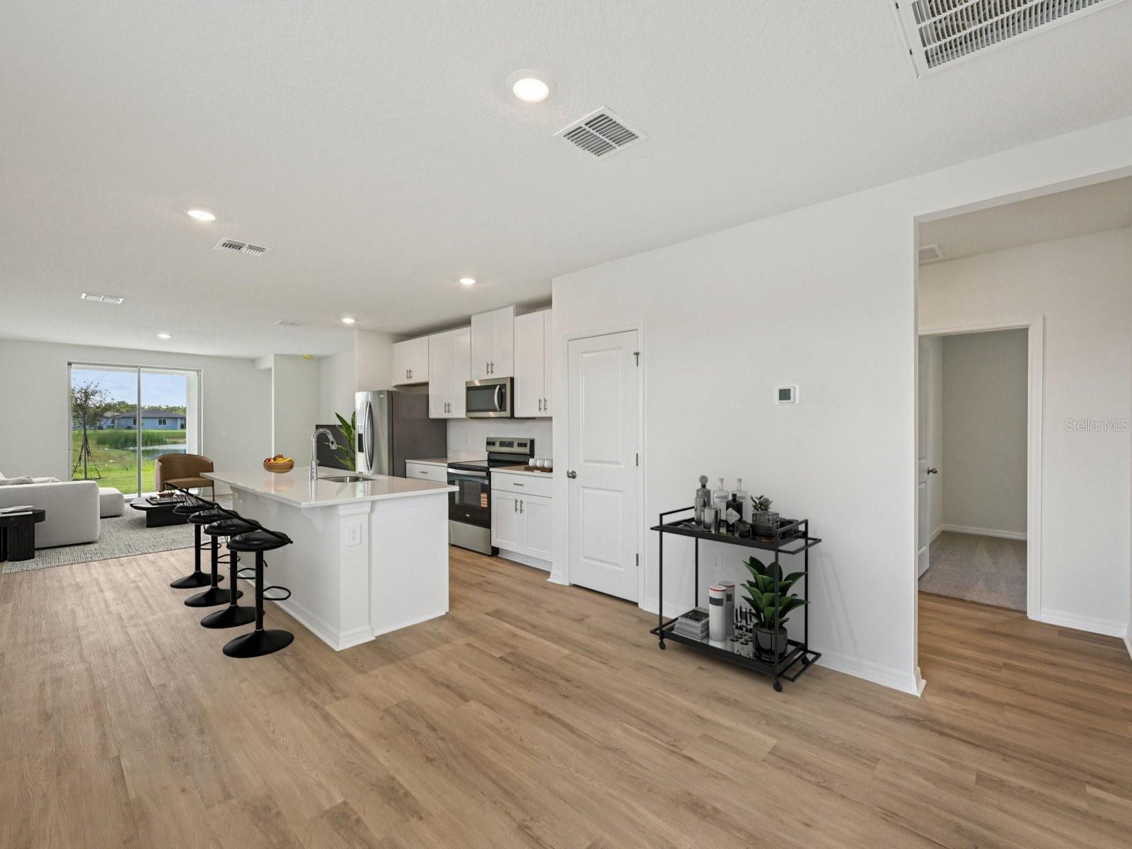 Interior photos are not of the actual home but are photos of the builder home with same floorplan with similar interior finishes and features. Photo uses virtual staging.
