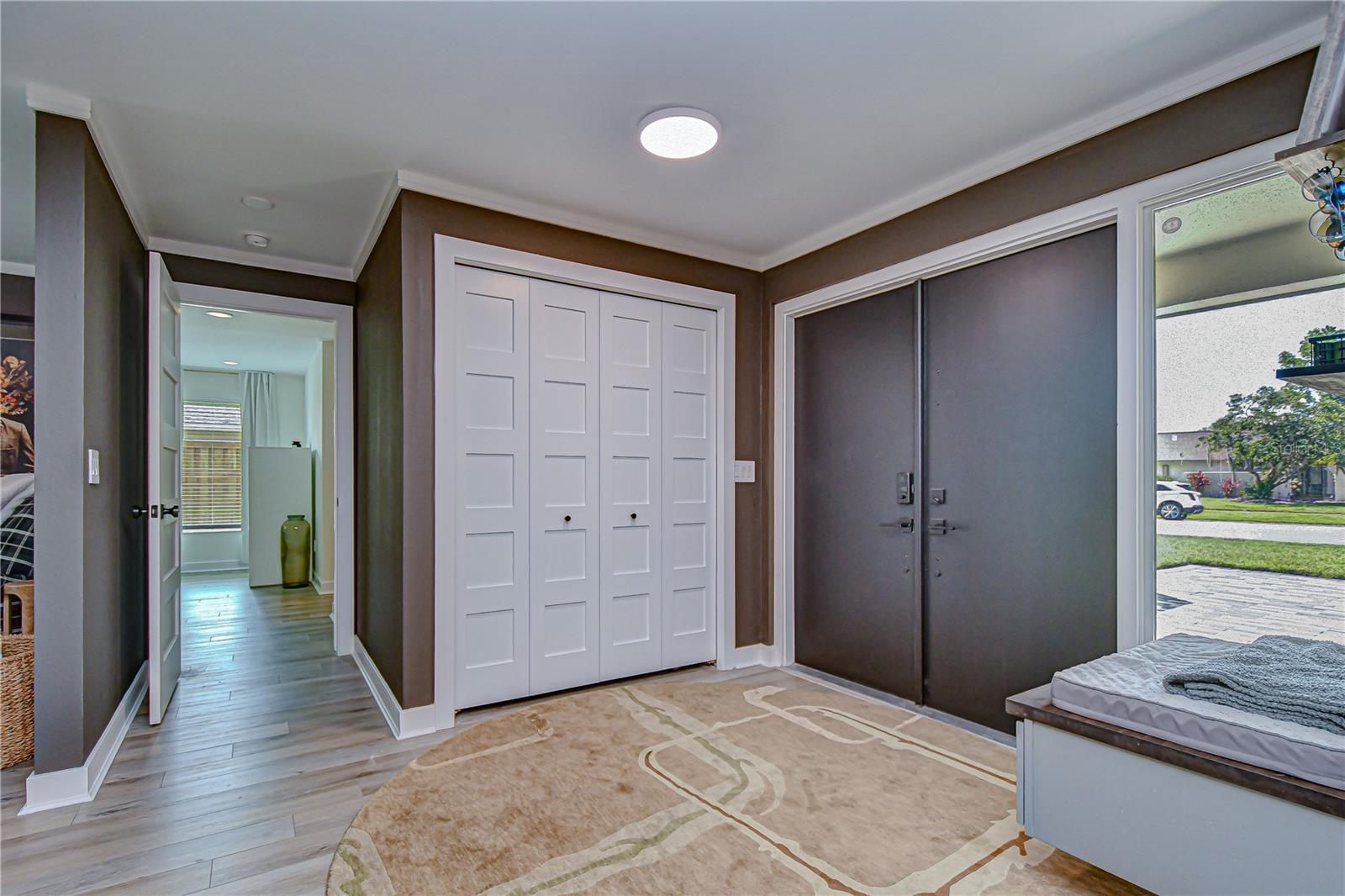 Foyer, Coat Closet, Bench Seat, Entrance to Primary Suite