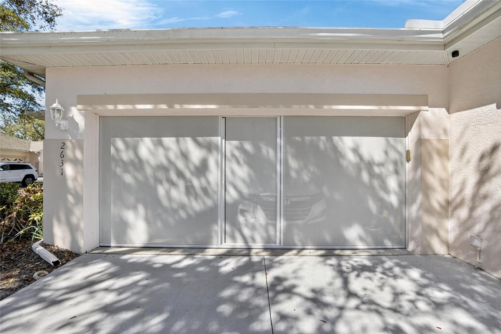 Screened enclosure for garage