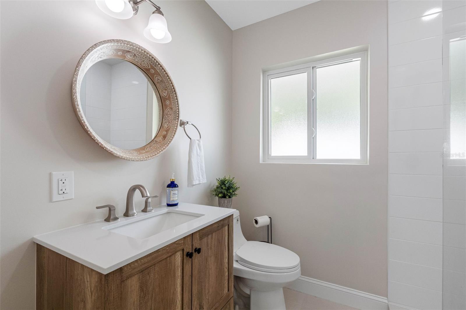 Bathroom by primary bedroom