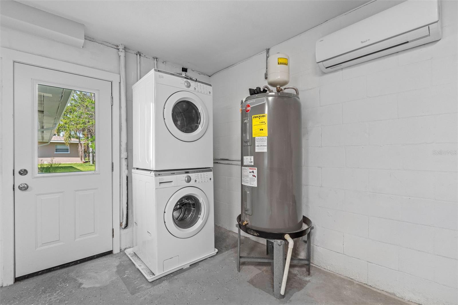 Washer, Dryer and Hot Water Heater in garage