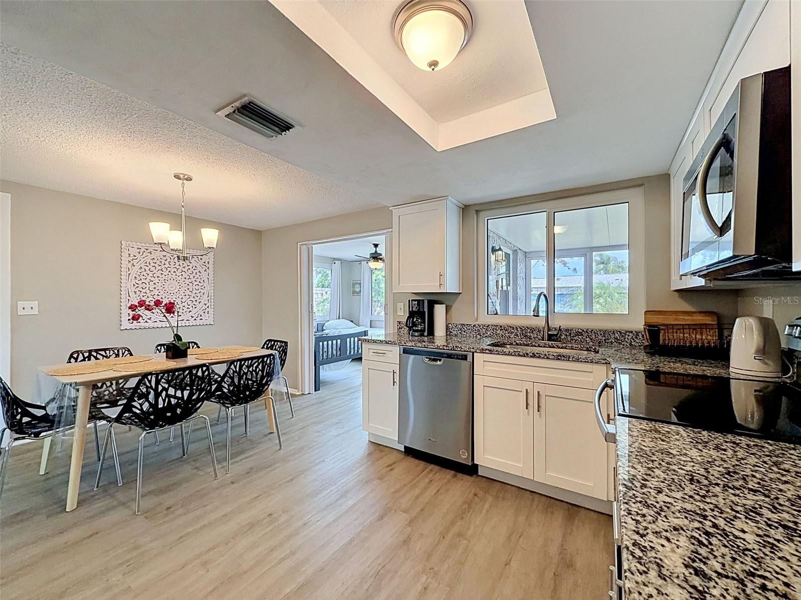 Dining Room looking into Great Room, now used as a Guest Room with a folding door
