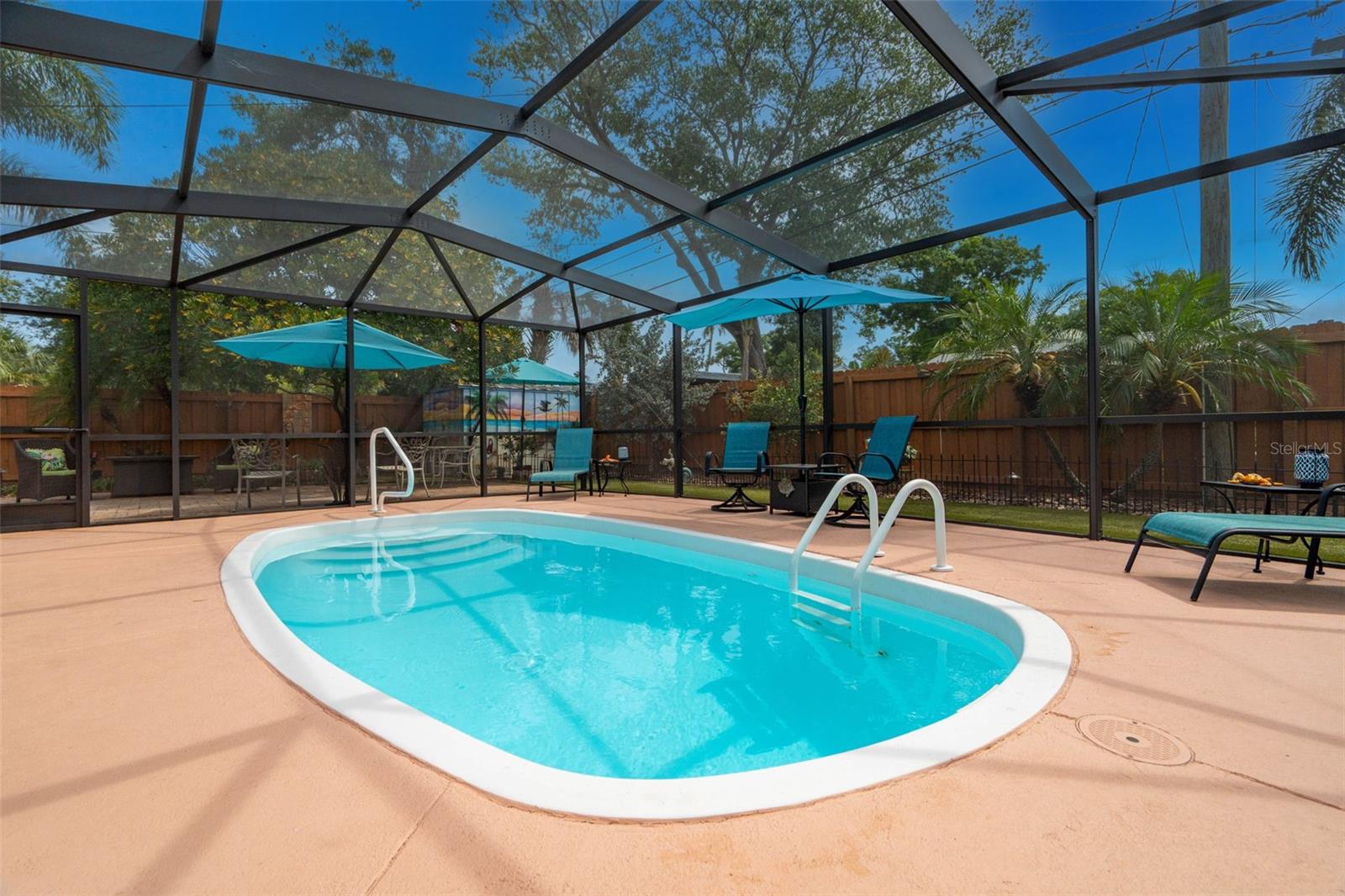 Pool with screen enclosure.