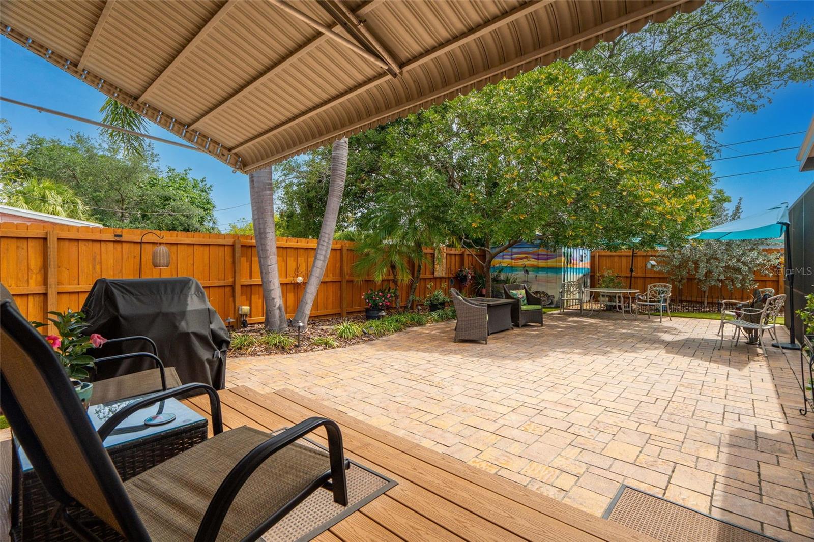 Covered porch featuring composite decking.