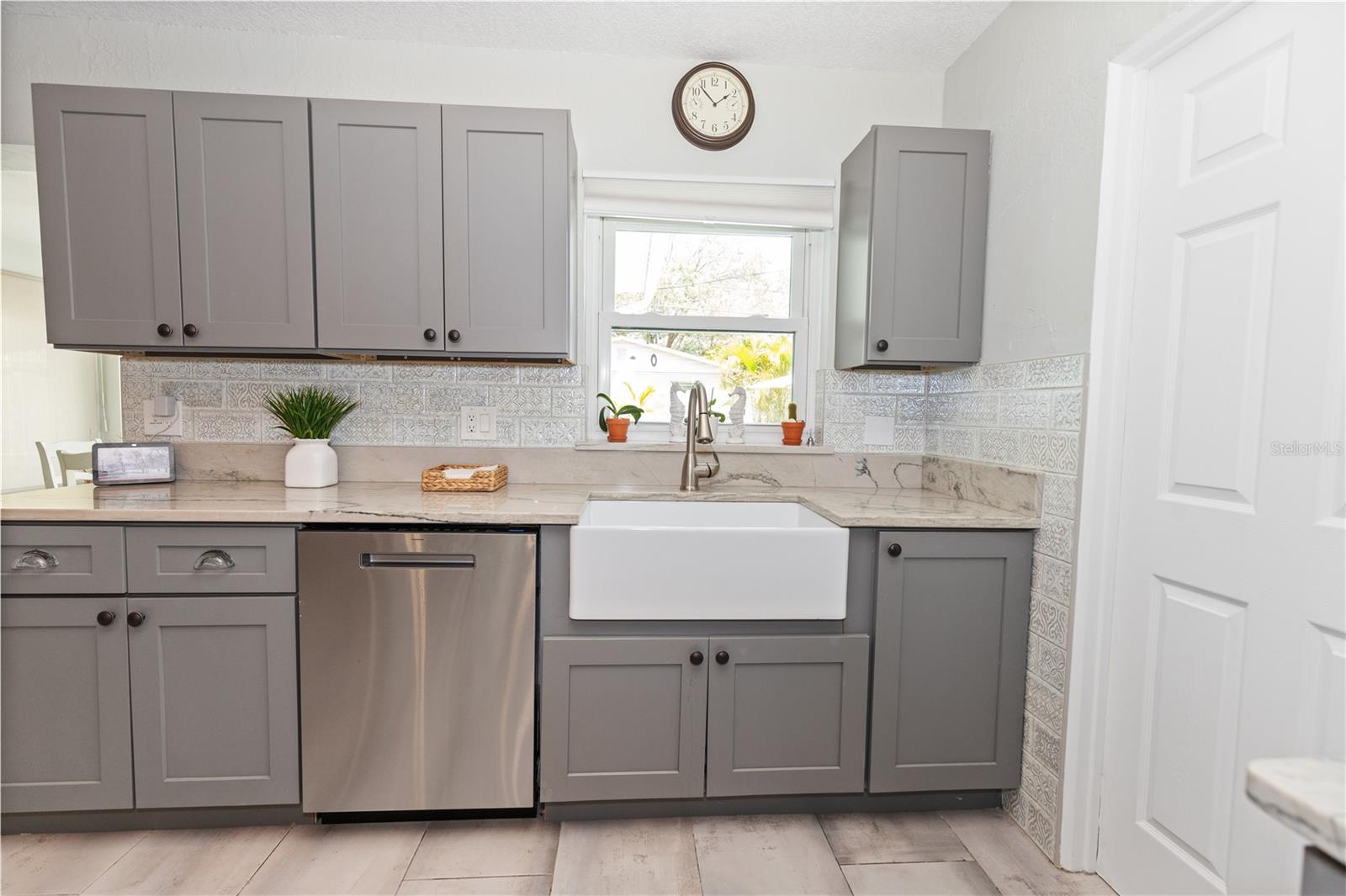 Farmhouse sink with window looking out to the back yard