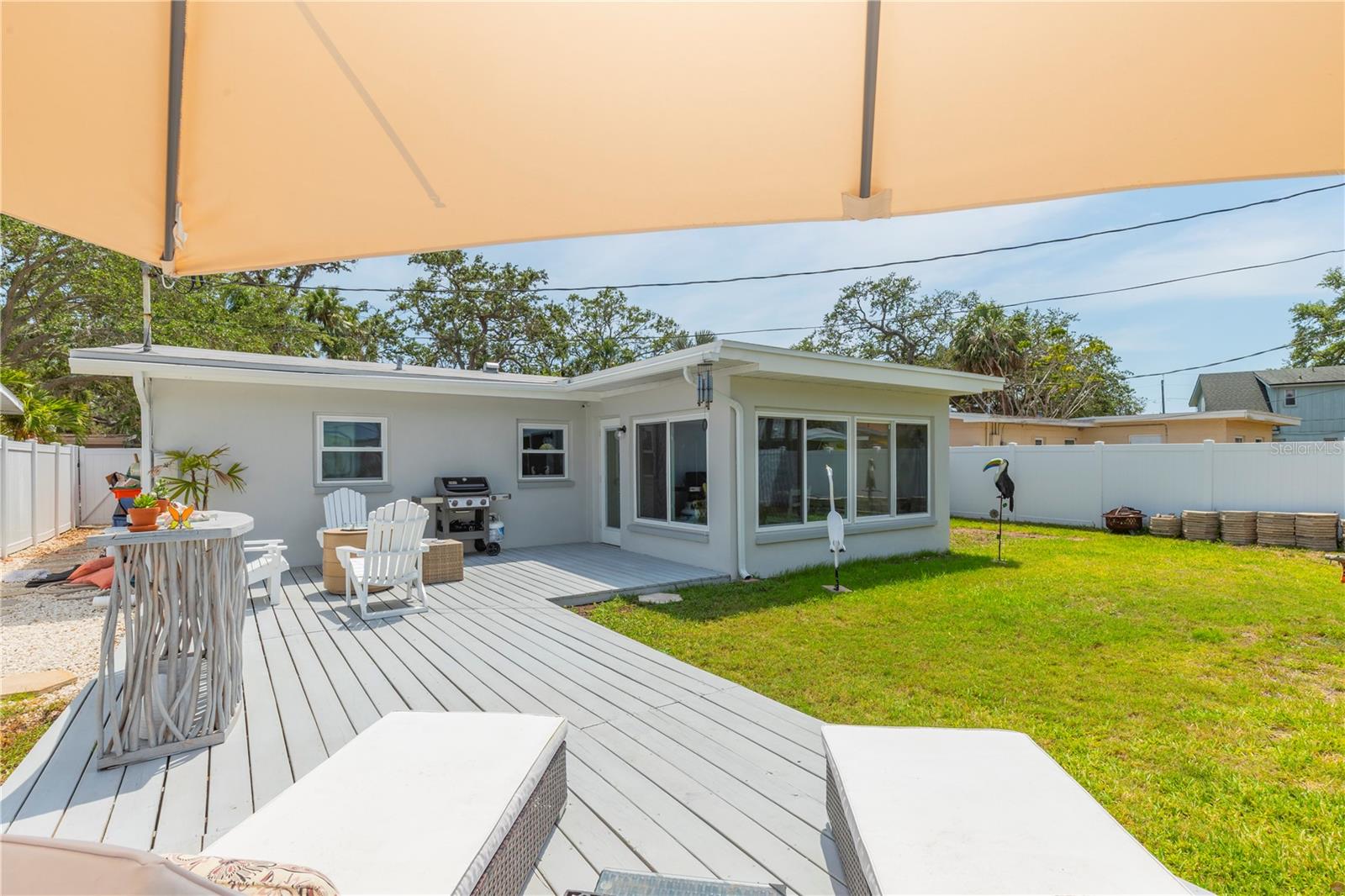 Totally fenced yard with gates on either side