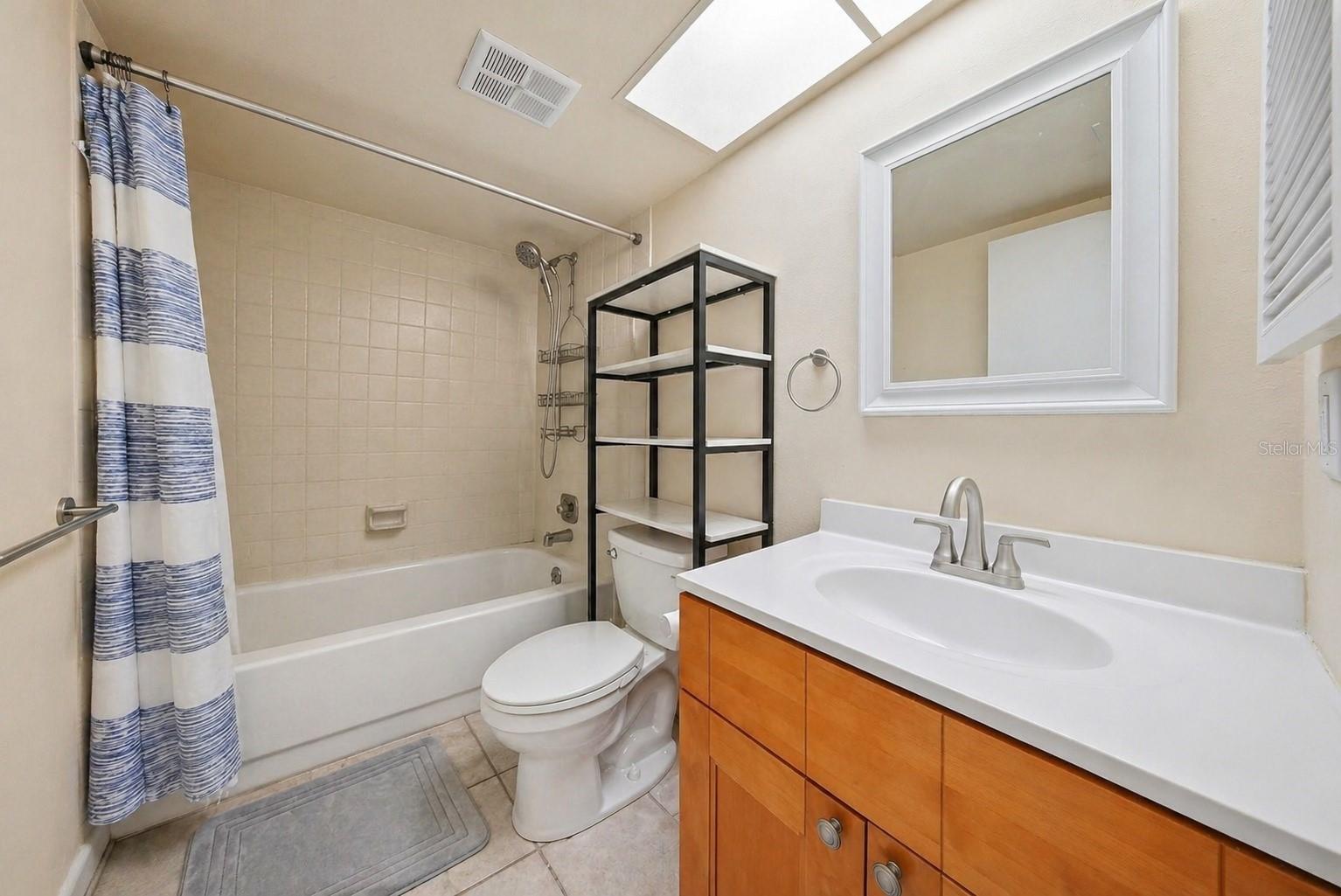 1st floor bathroom with a tub