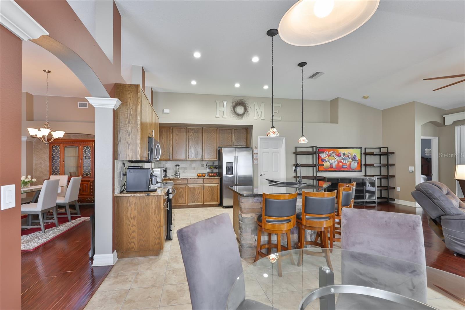 Breakfast/casual dining area and kitchen with seating at the island