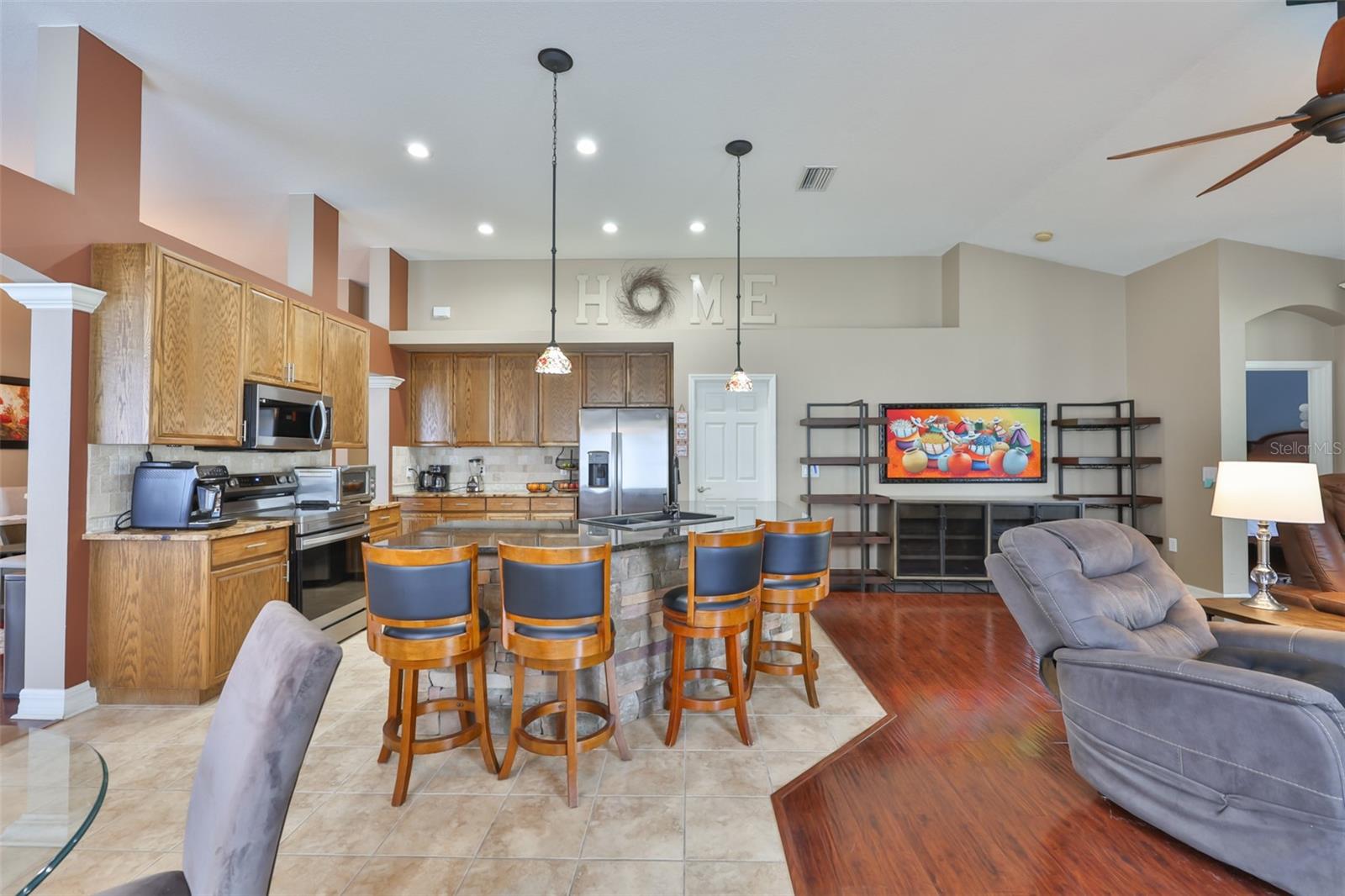 Pendant and recessed lights in the bright kitchen