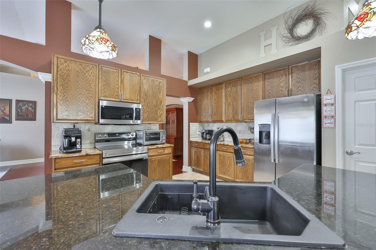 Black sink and granite counters