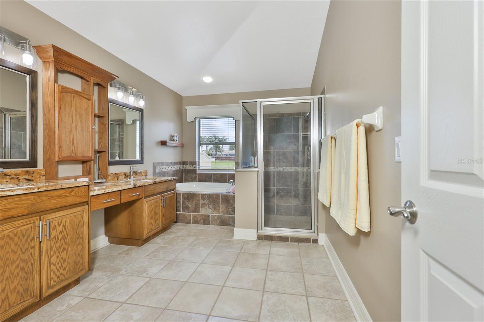 Primary bath has garden tub and separate shower