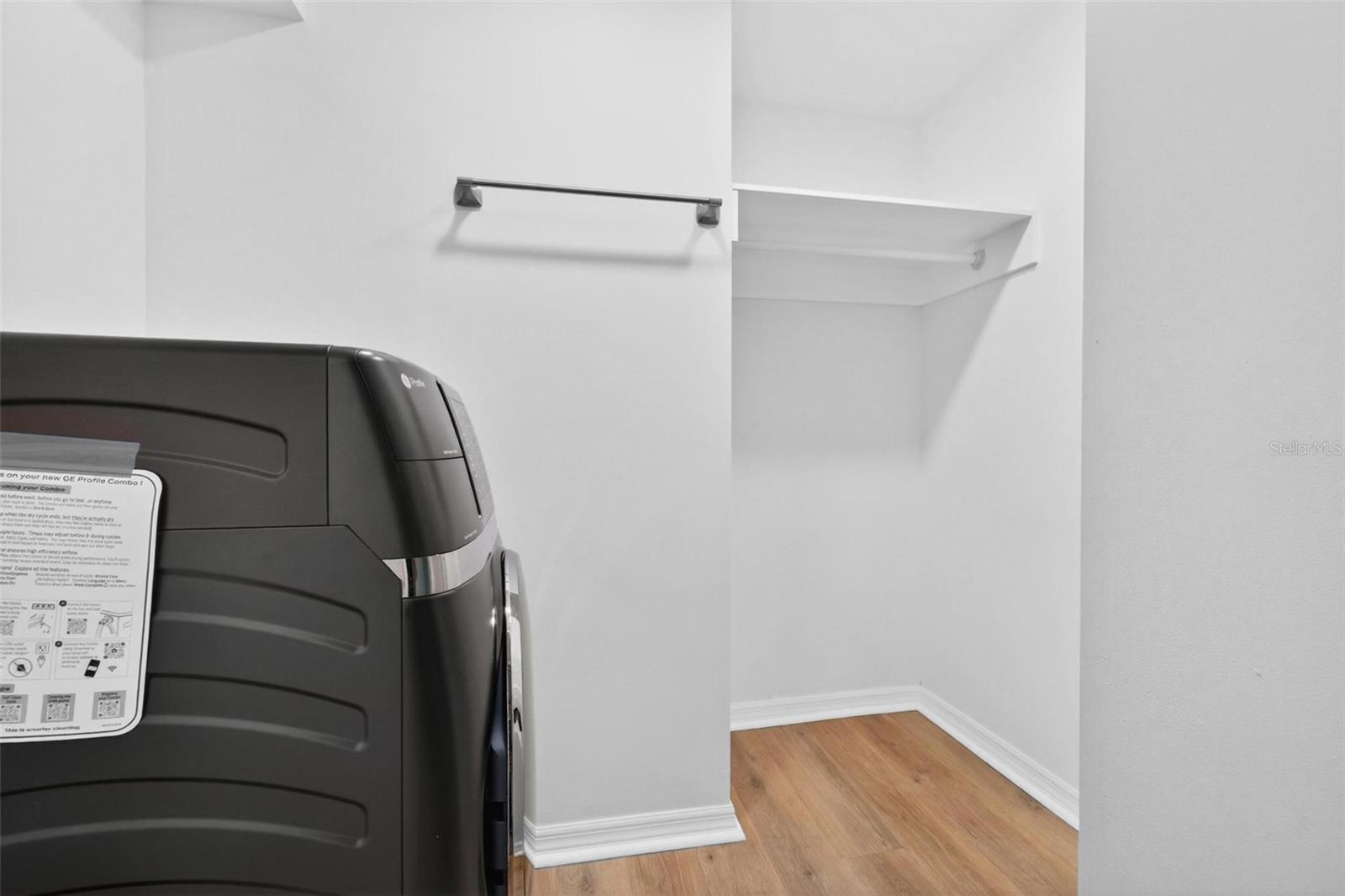 Inside Laundry Room with Combo Washer Dryer