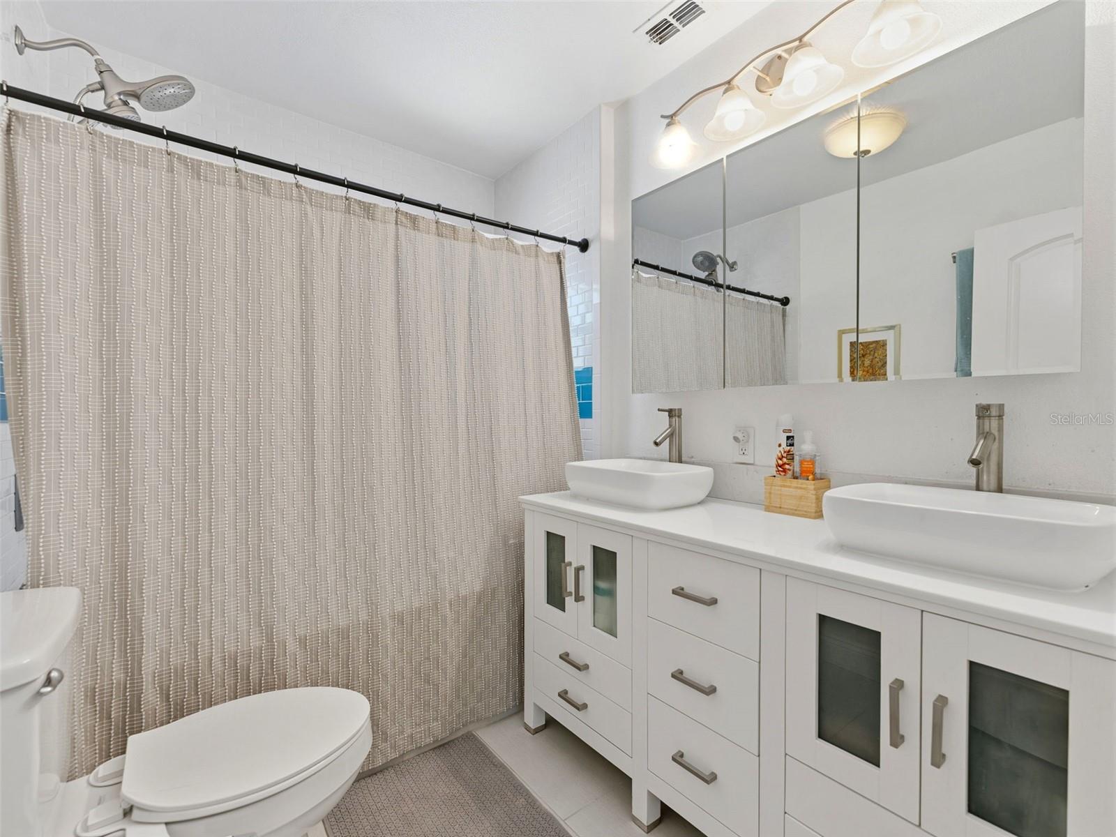 Double sinks in your nicely updated bathroom