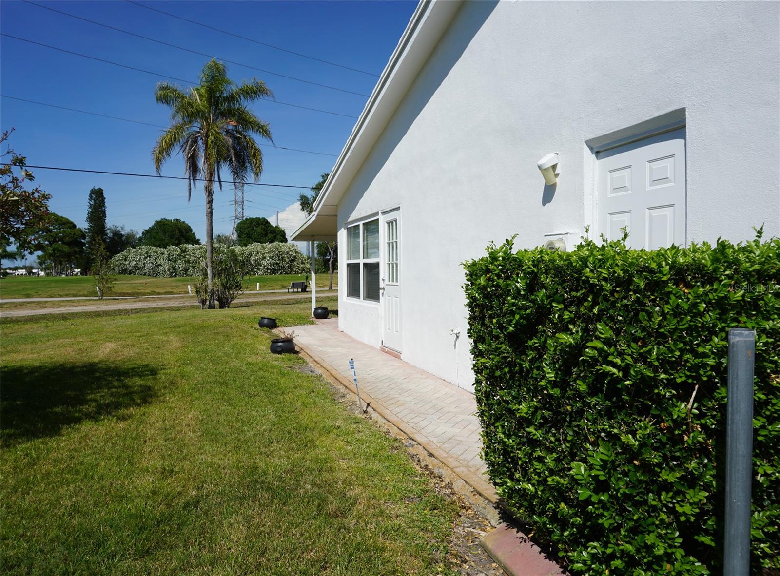 Side of house walking toward the back