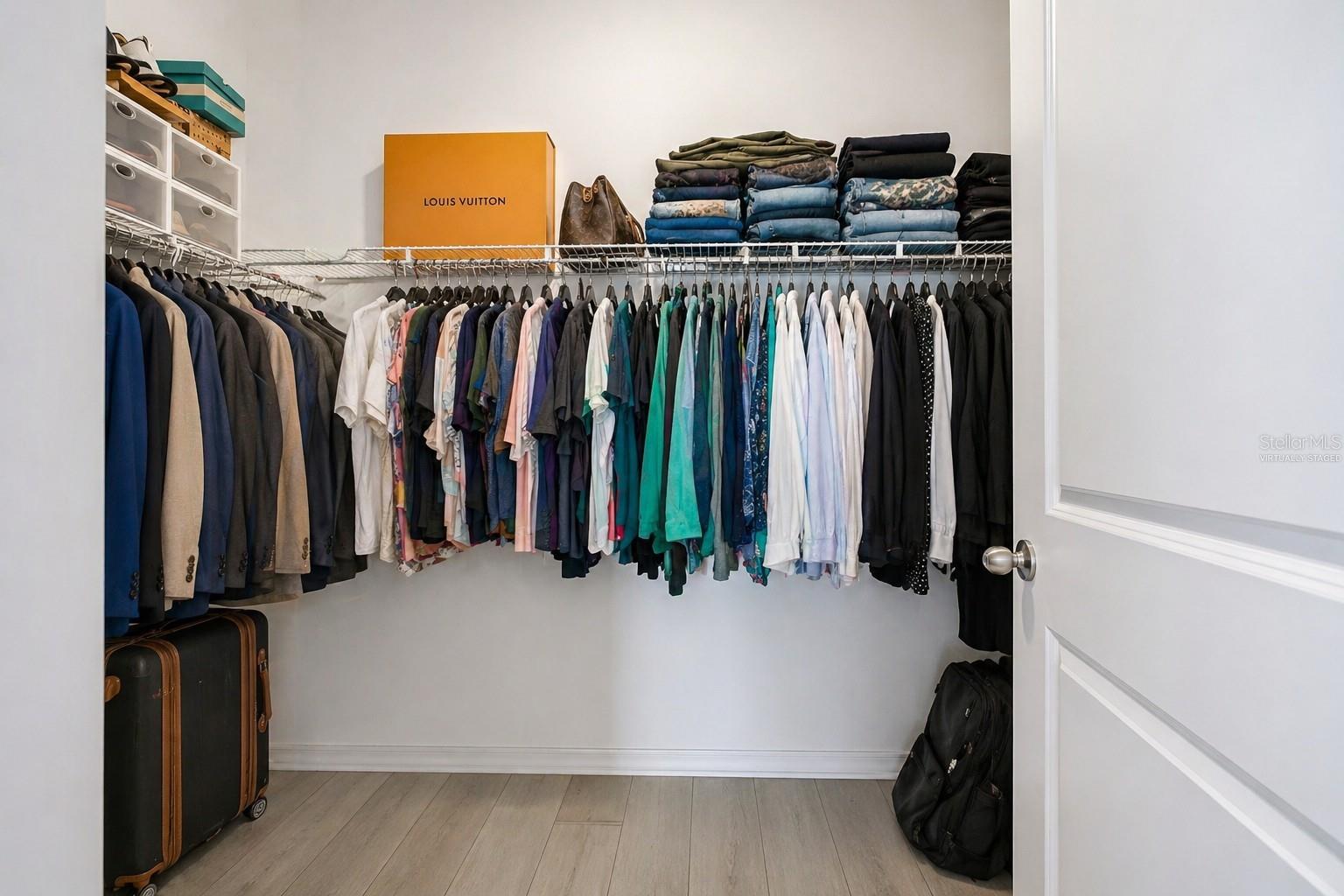 Primary BR Walk-in closet (Virtually Staged)