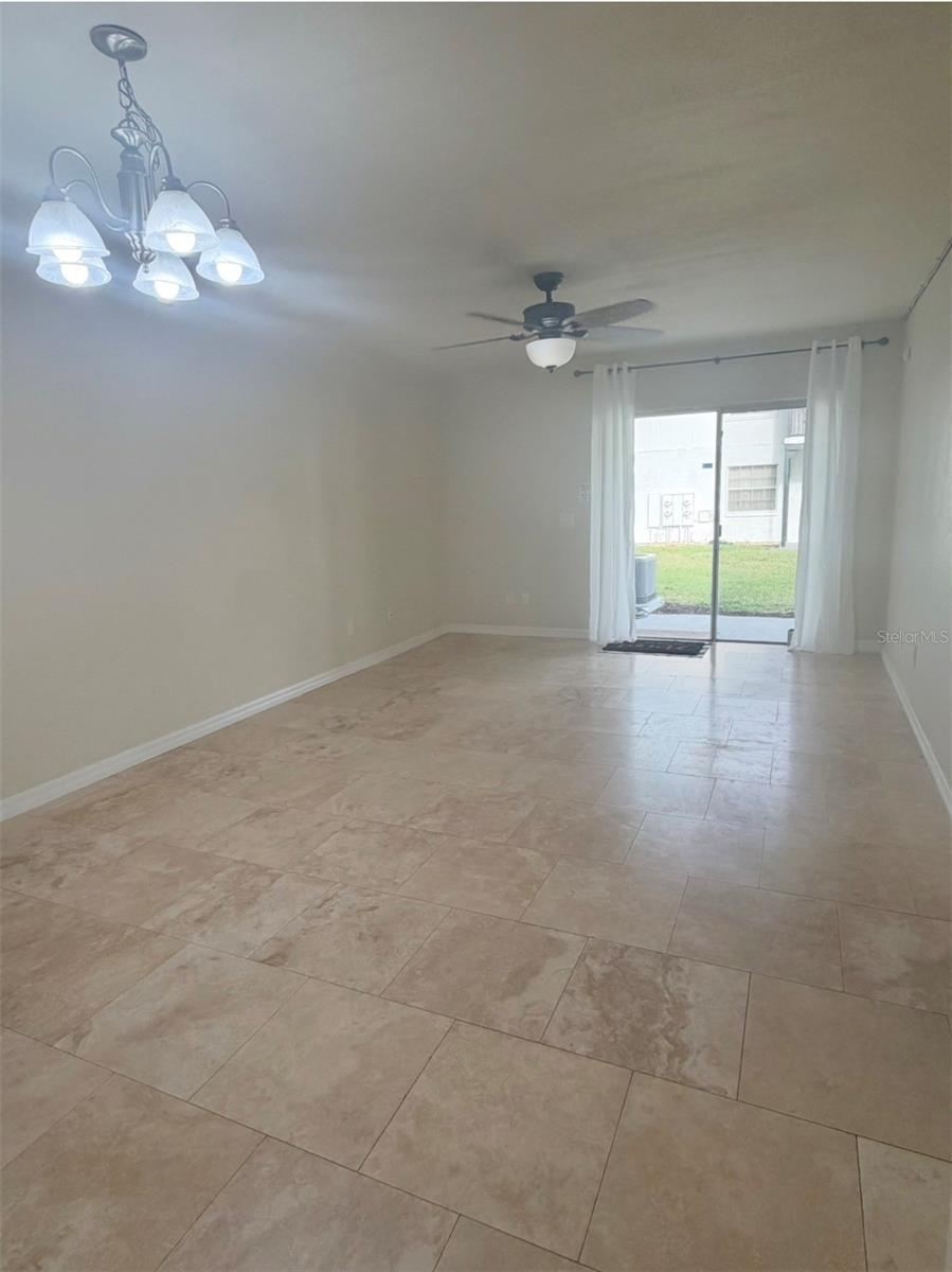 The living is 20x12 and features travertine floors.