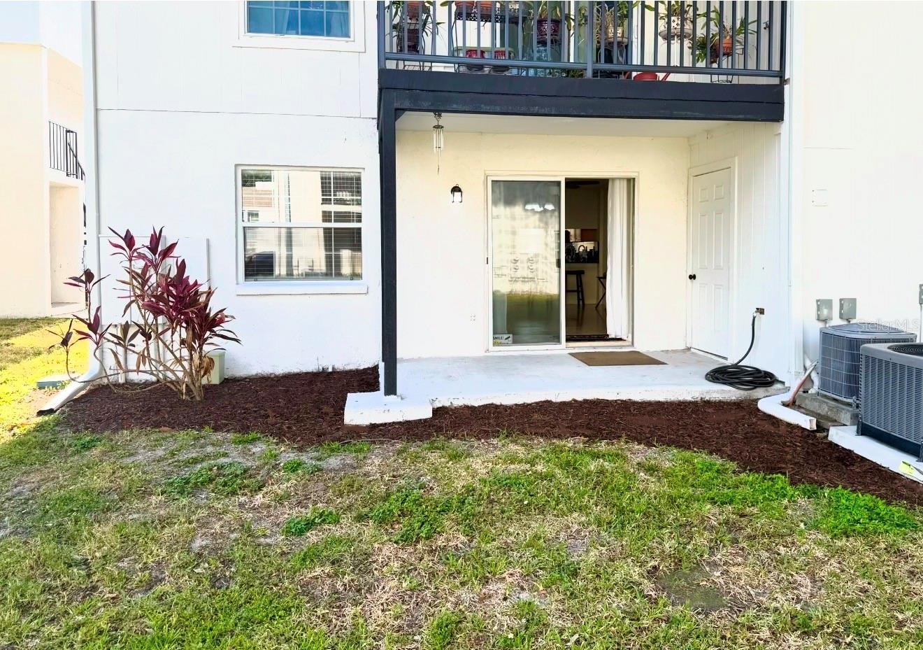 There's a lot of space for playing or running around in the backyard.