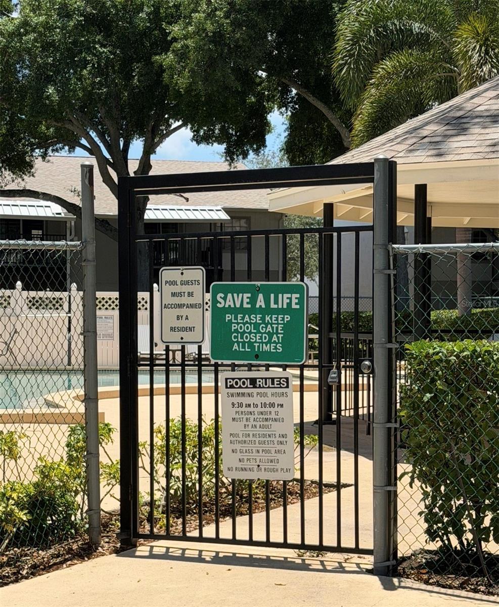 The pool area is gated for safety.