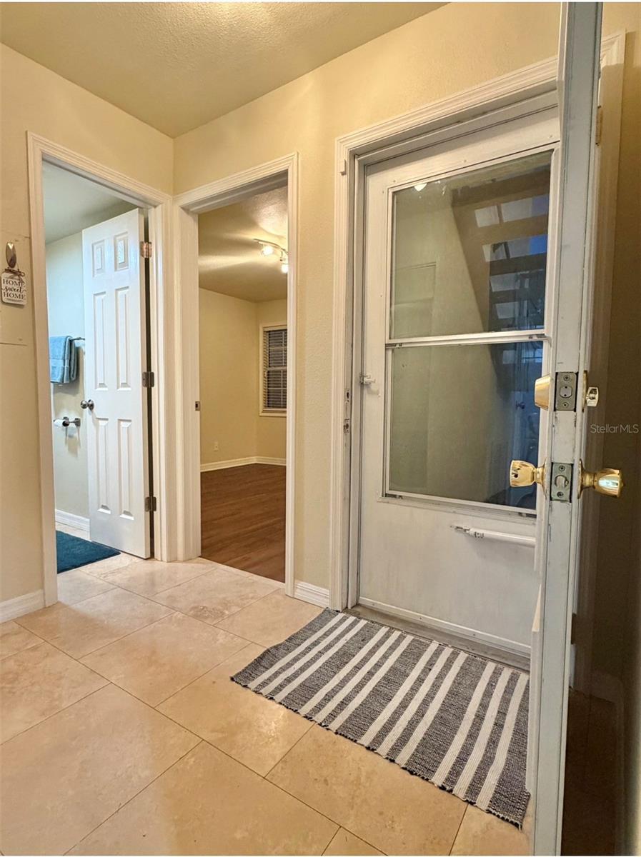 Just inside the entrance is a bedroom and a full bathroom.