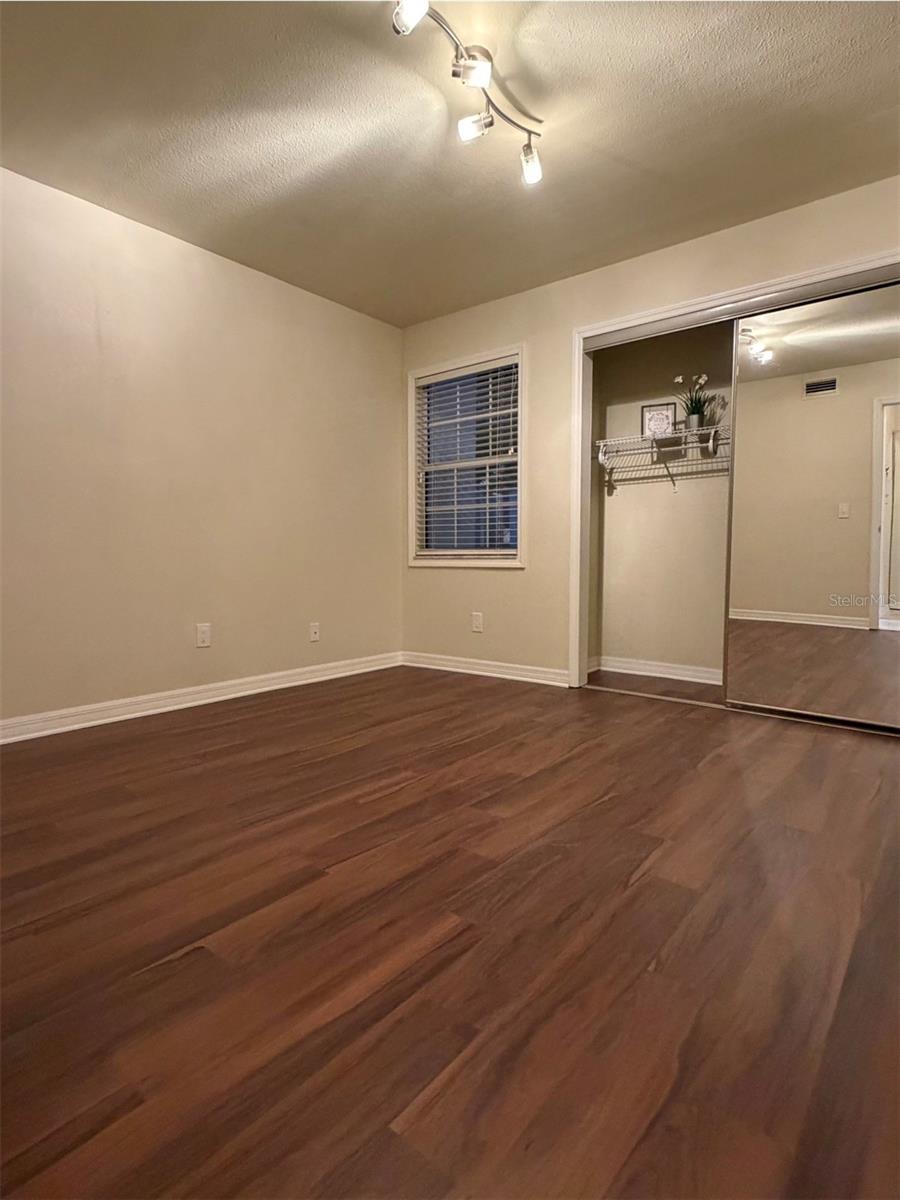 The second bedroom is 11x11 and has a large closet with full-length mirror doors.