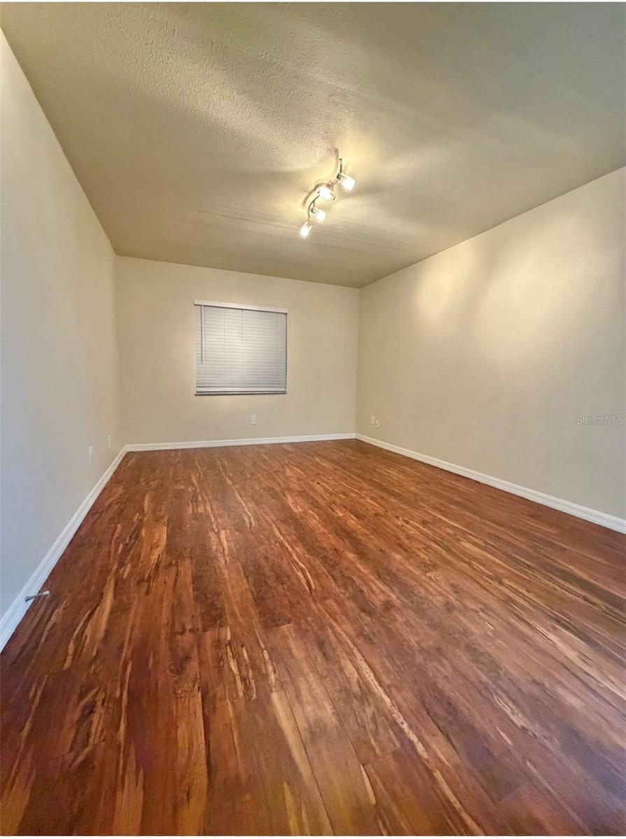 The primary bedroom is 16x11 and features LVP flooring, an updated ensuite, and a walk-in closet.