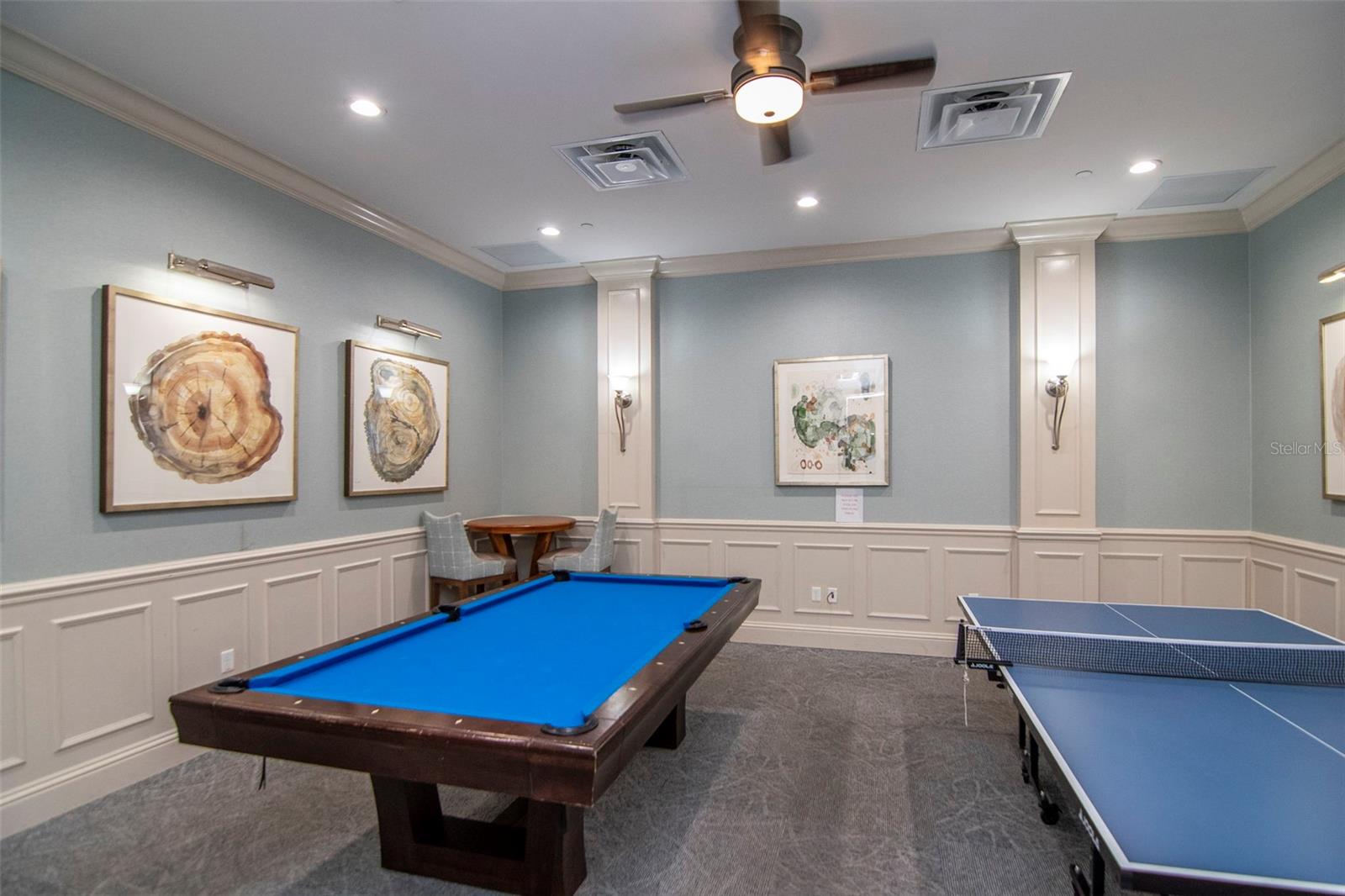 Clubhouse game room with ping pong and pool table