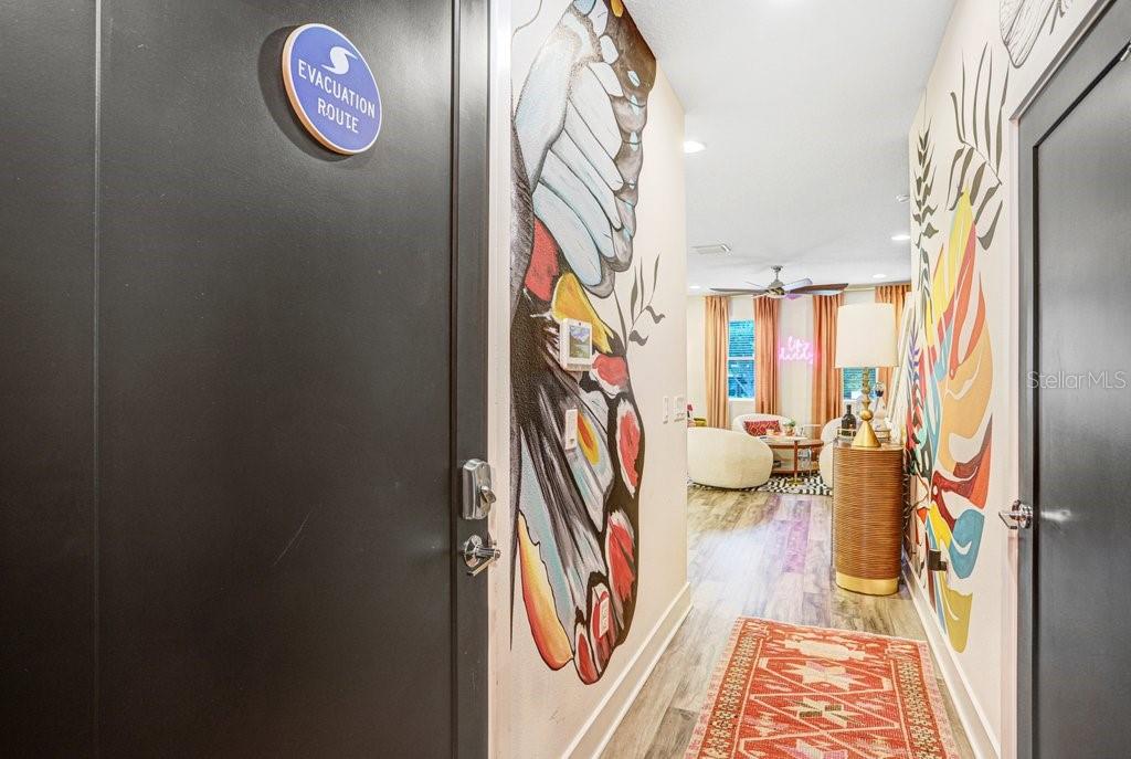 hallway leading to powder bathroom and garage