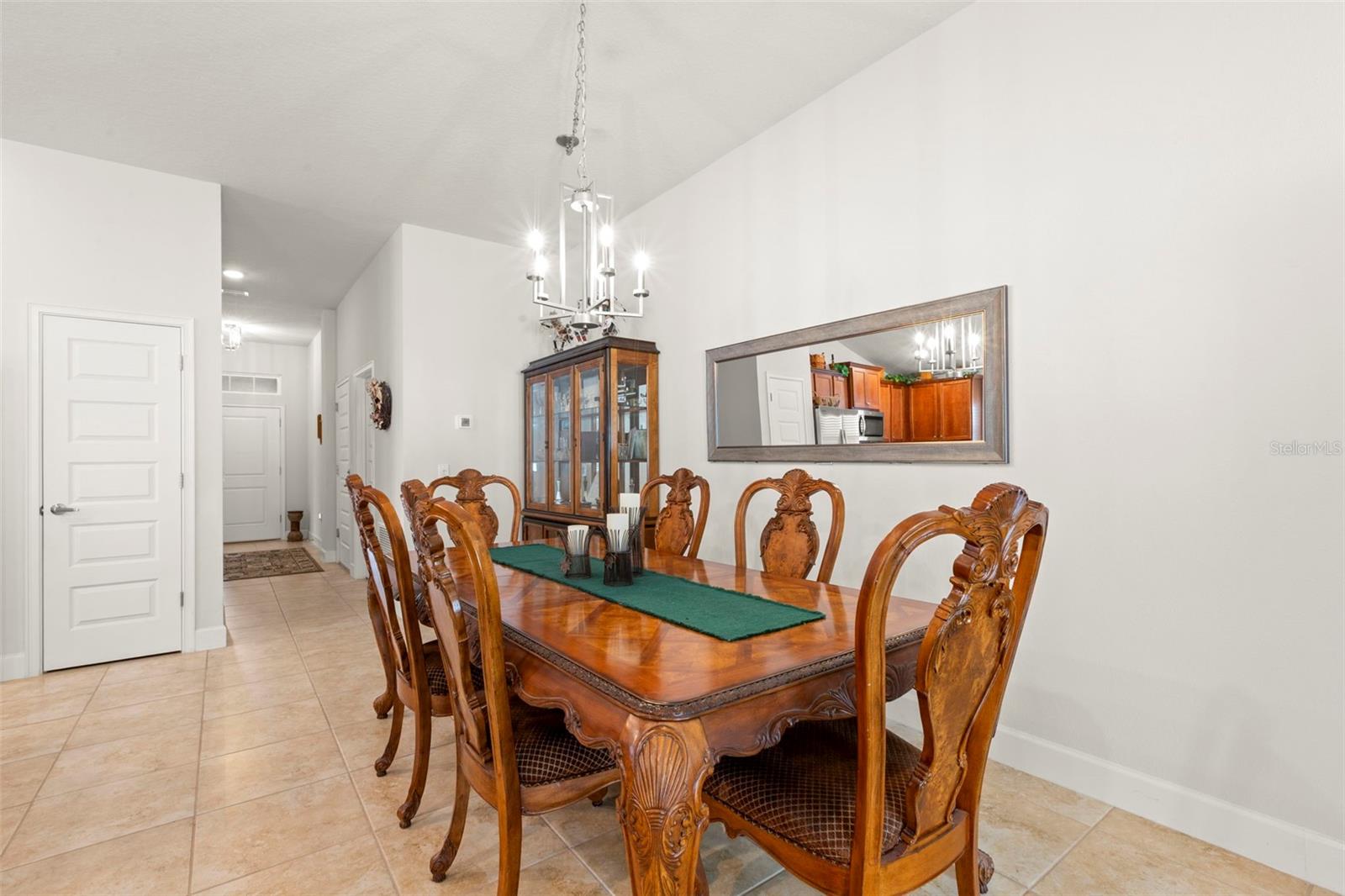 The open dining area provides defined space for formal entertaining while remaining seamlessly integrated with the home’s open-concept layout.