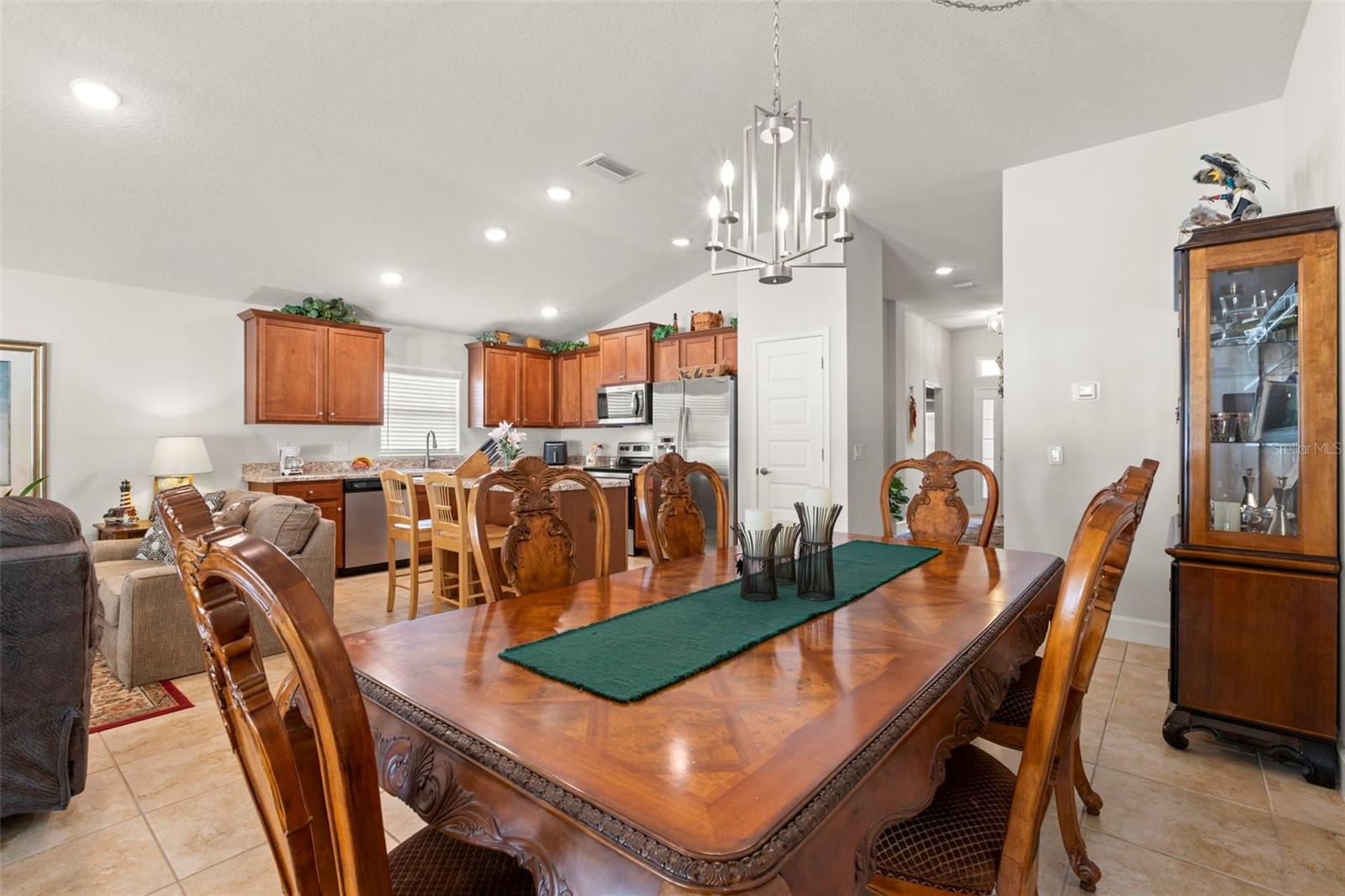 Positioned just off the kitchen, the dining area offers effortless serving and entertaining flow while maintaining open connectivity to the home’s main gathering spaces.