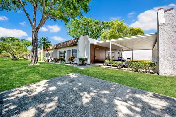 FRONT/SIDE VIEW W/CARPORT