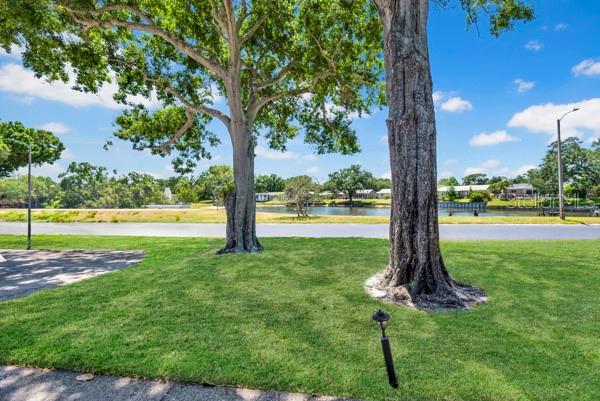 VIEW OF FRONT YARD WITH POND VIEW