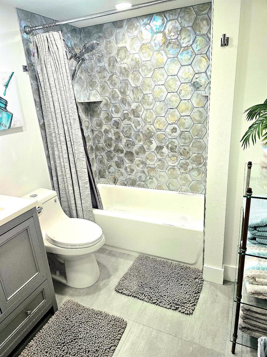 The hall bath is large and completely outfitted.