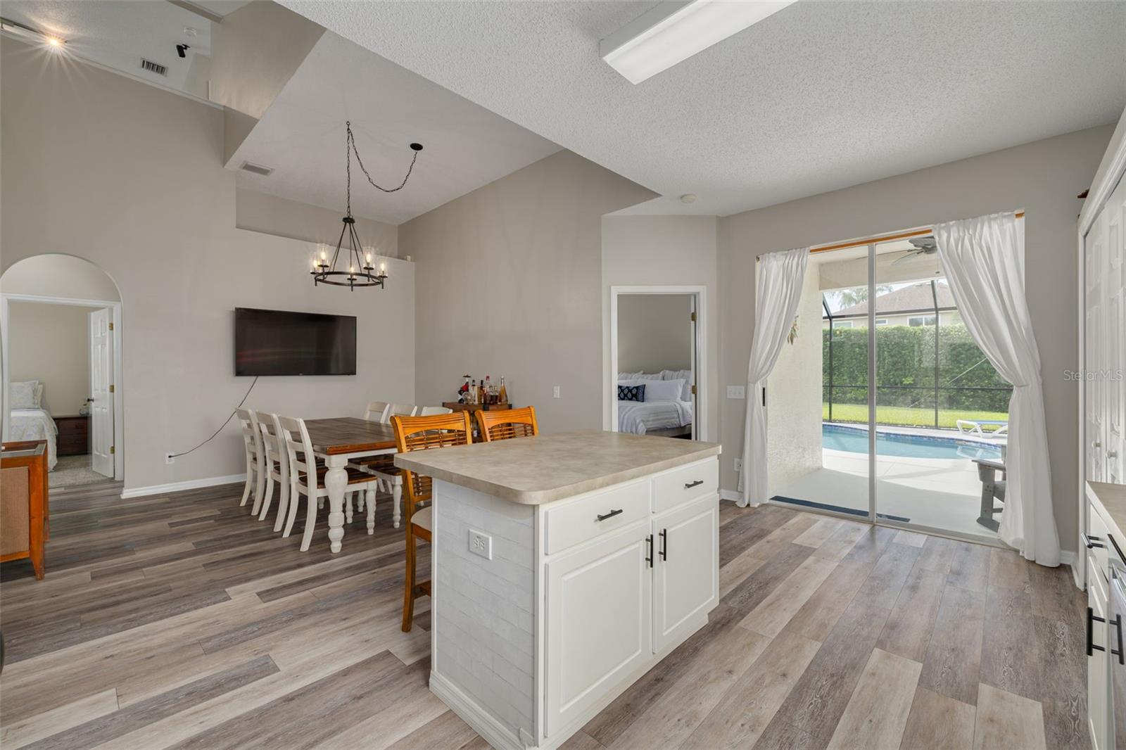 Primary ensuite is on the right, two bedrooms and a full bathroom are on the left.