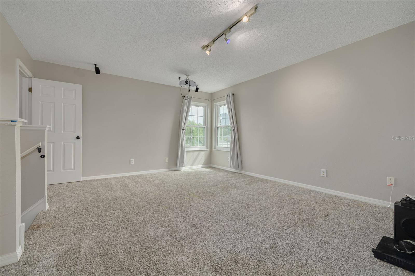 Upstairs, BONUS room with large walk-in closet!