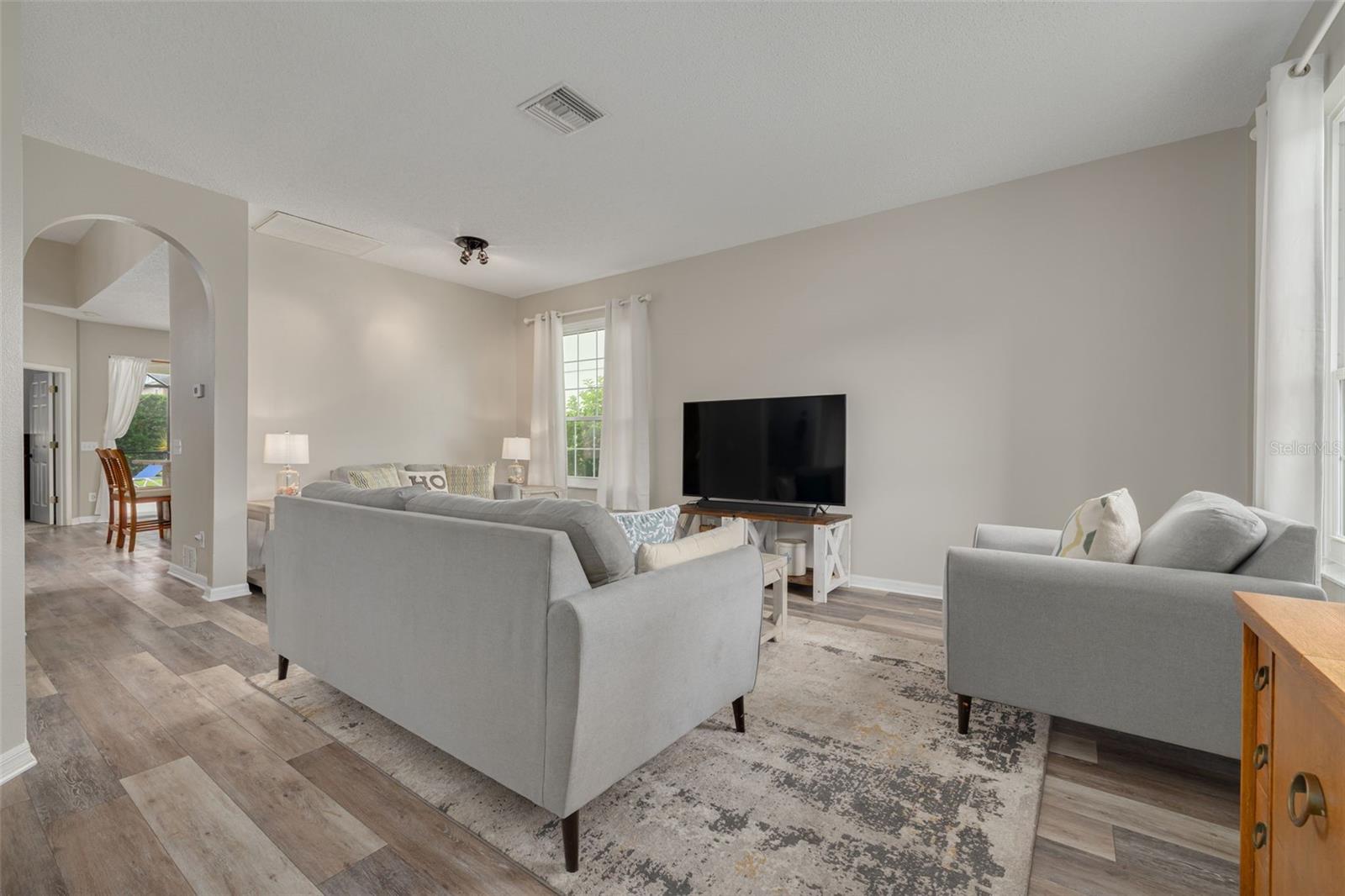 Natural light pours through hurricane-rated living room windows!