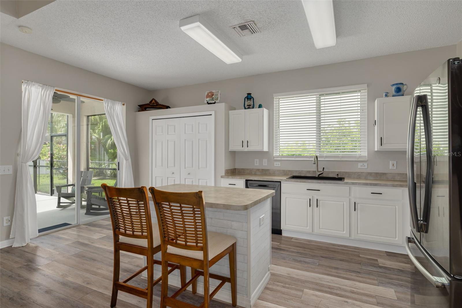 Large pantry with sliders to the screened lanai!