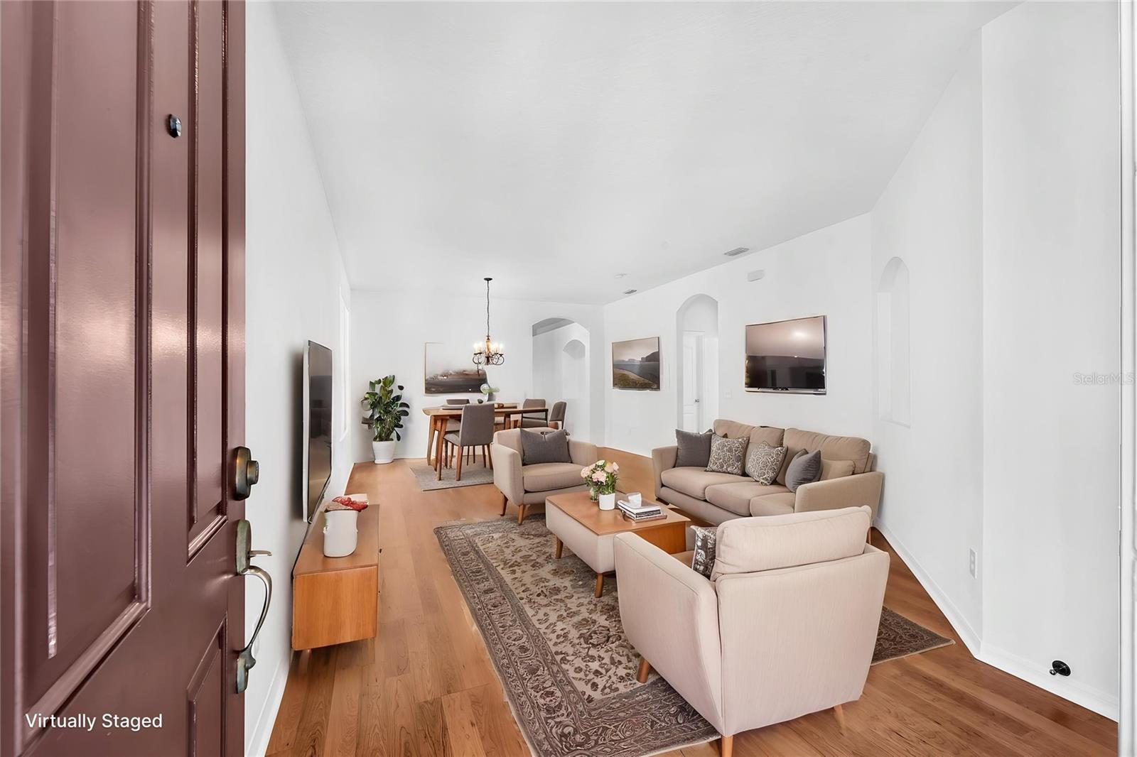 The spacious front living/dining area provides plenty of room for both relaxing and a large dining table, making it ideal for entertaining.