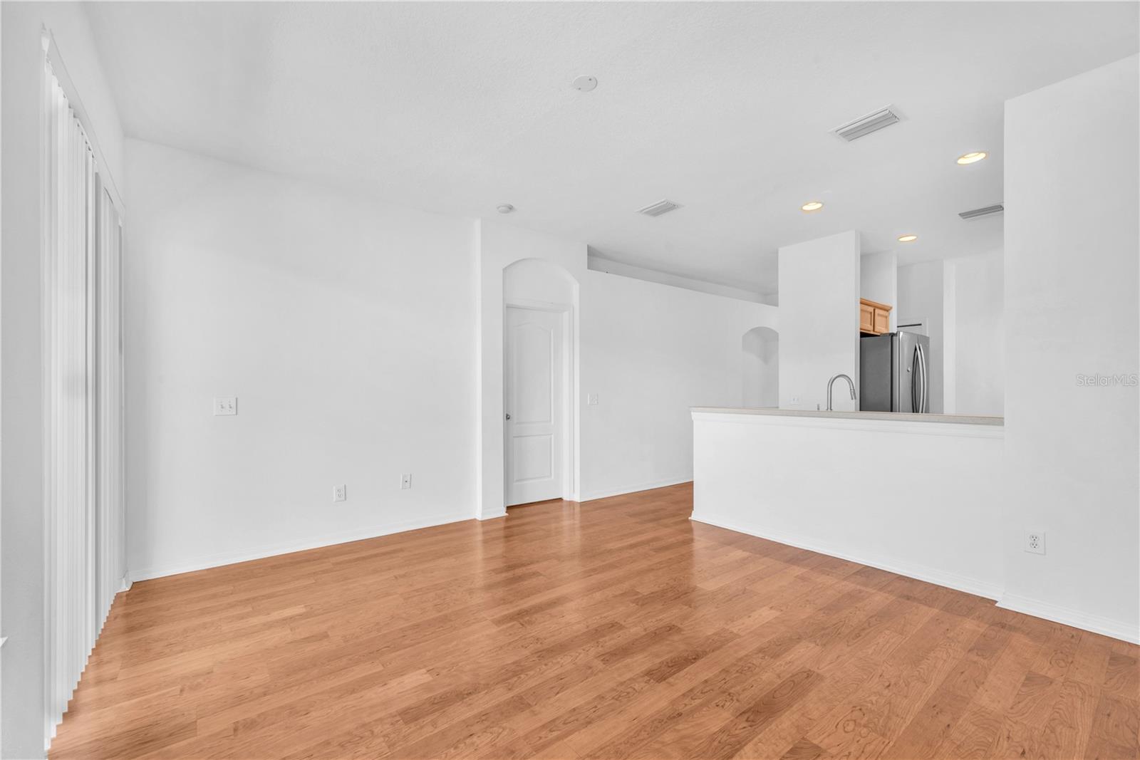 Access to Primary Bedroom is next to the Kitchen and Family Room.