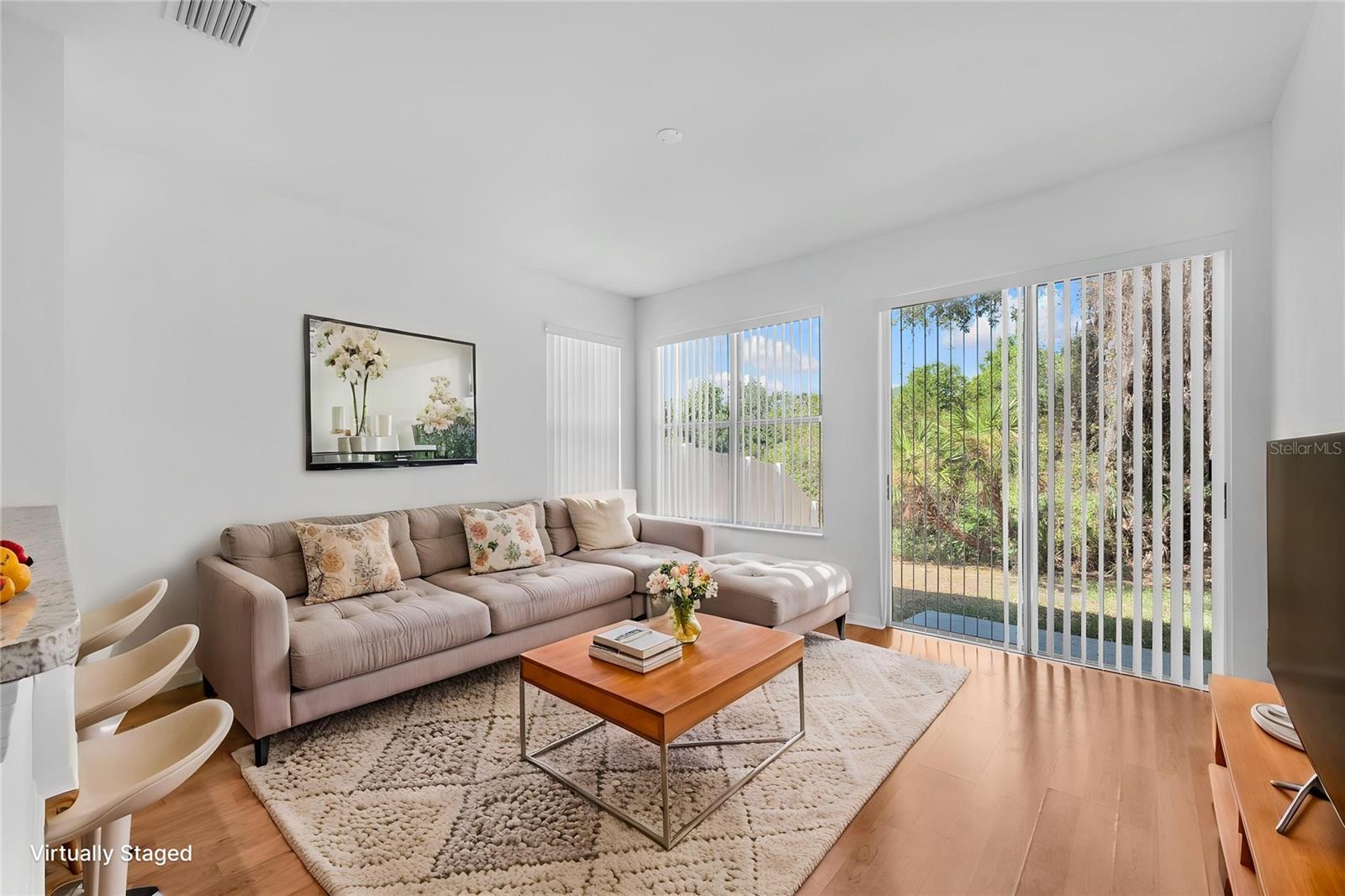 The family room has sliding glass doors to access the private patio and backyard, creating seamless indoor-outdoor living.