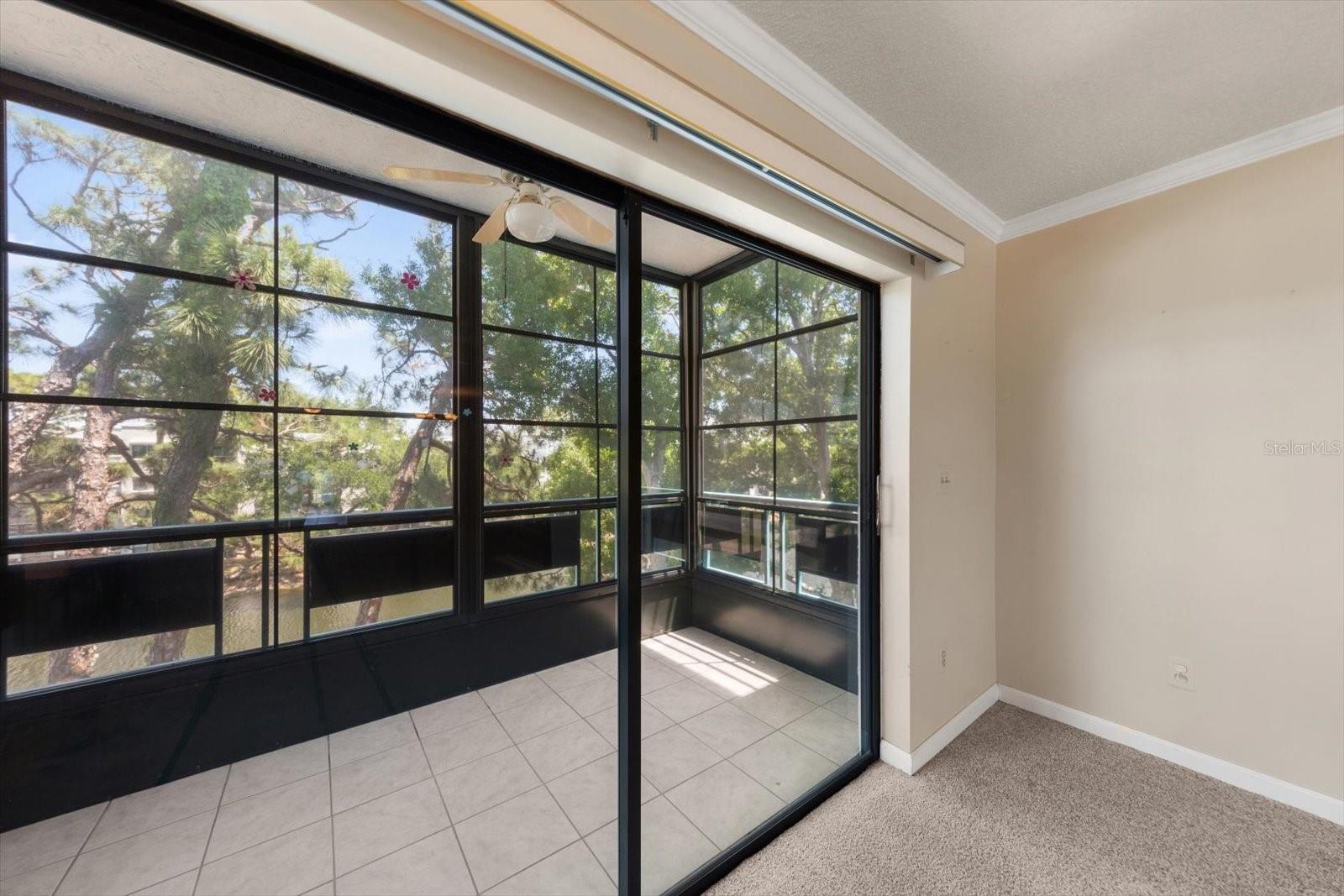 Fabulous enclosed porch that can have the panels removed to have just he screen. Great all weather porch overlooking the pond