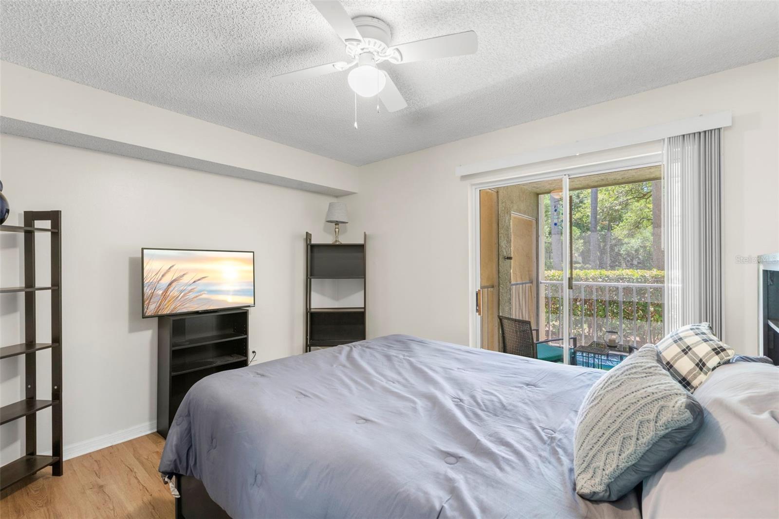 Bedroom with access to screened in patio