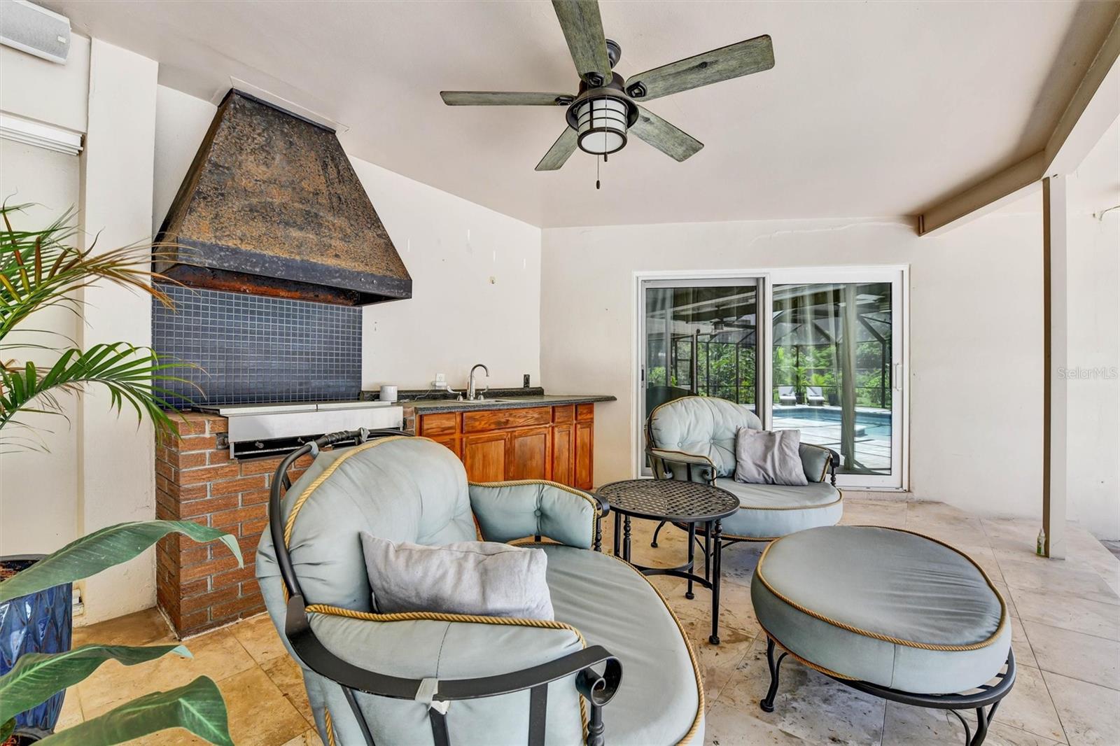 Outdoor kitchen area off of pool