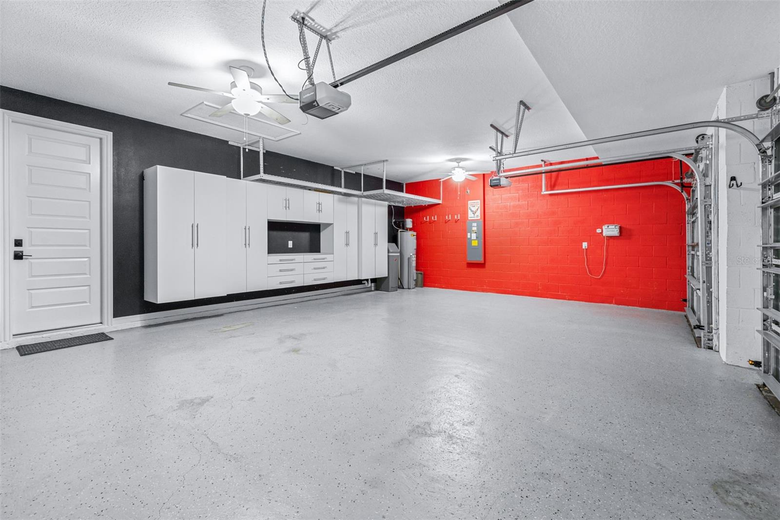 Three Car Garage with Built-in Storage Throughout