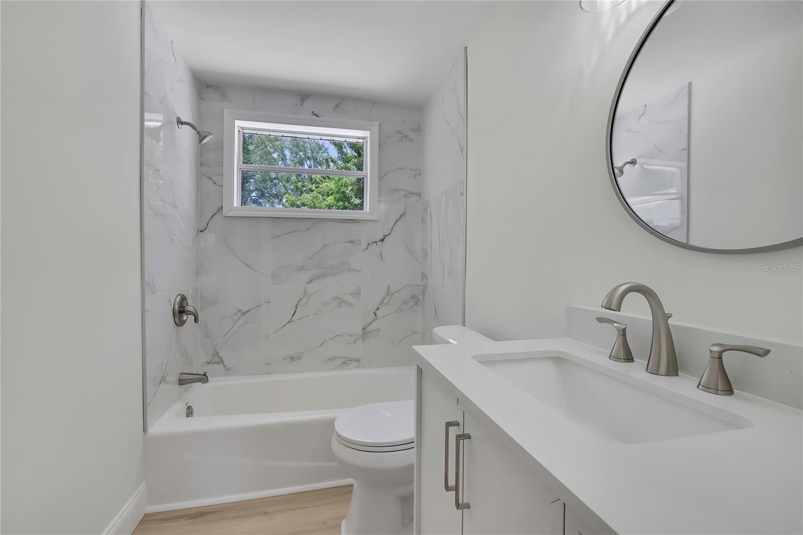 NEW TUB, NEW TILE, NEW TOILET, NEW HARDWARE/MIRROR AND NEW VANITY