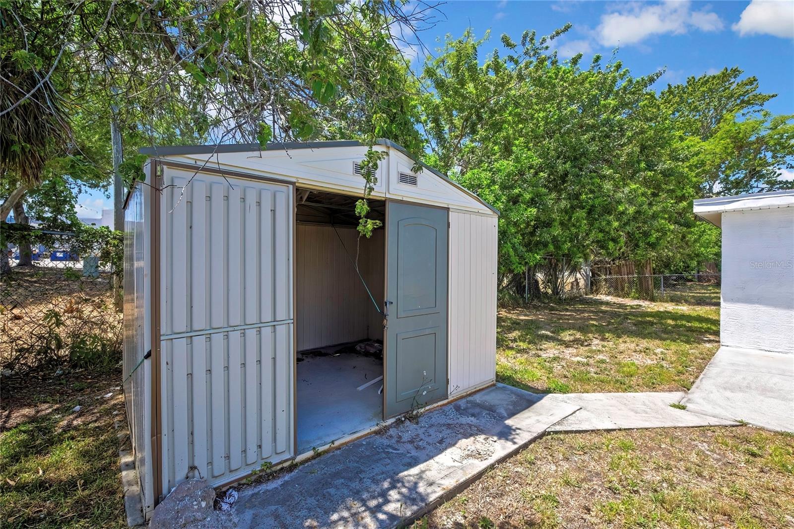 Double door shed on a concrete pad