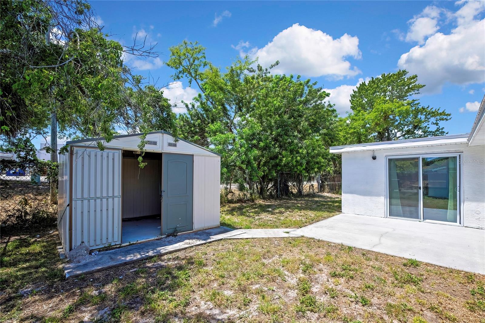 Double door shed on a concrete pad
