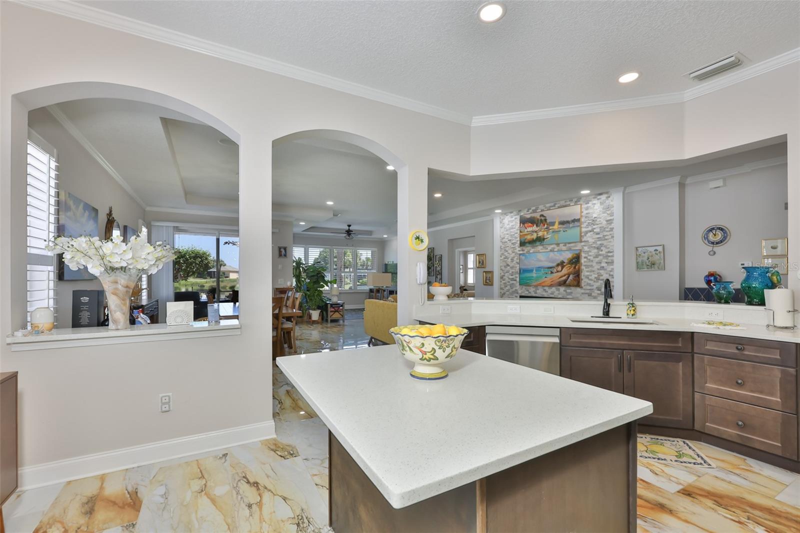Granite counters and elegant arches make this home special.