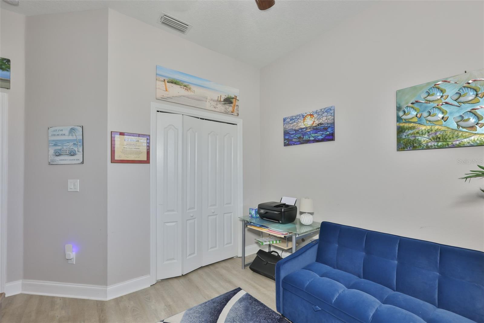 A large double wall closet is perfect for storage.